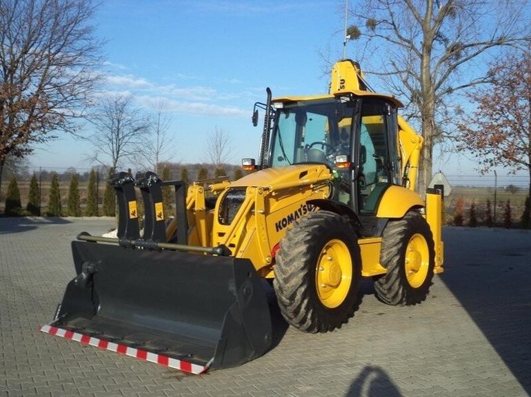 Komatsu WB97S universal earthmoving loader. Photo №4